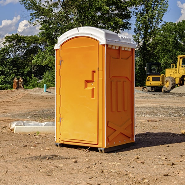 what is the cost difference between standard and deluxe portable restroom rentals in Benner